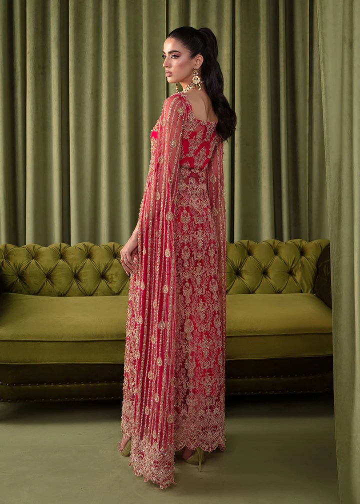 Model wearing Kanwal Malik Elara Luxury Pret '24 Mirage dress in red, showcasing Pakistani wedding clothes online in the UK.