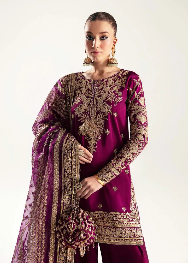 Model wearing deep purple Hania dress from Kanwal Malik, Jugan Luxury Pret 2024 collection. Pakistani clothes online in UK, wedding clothes.