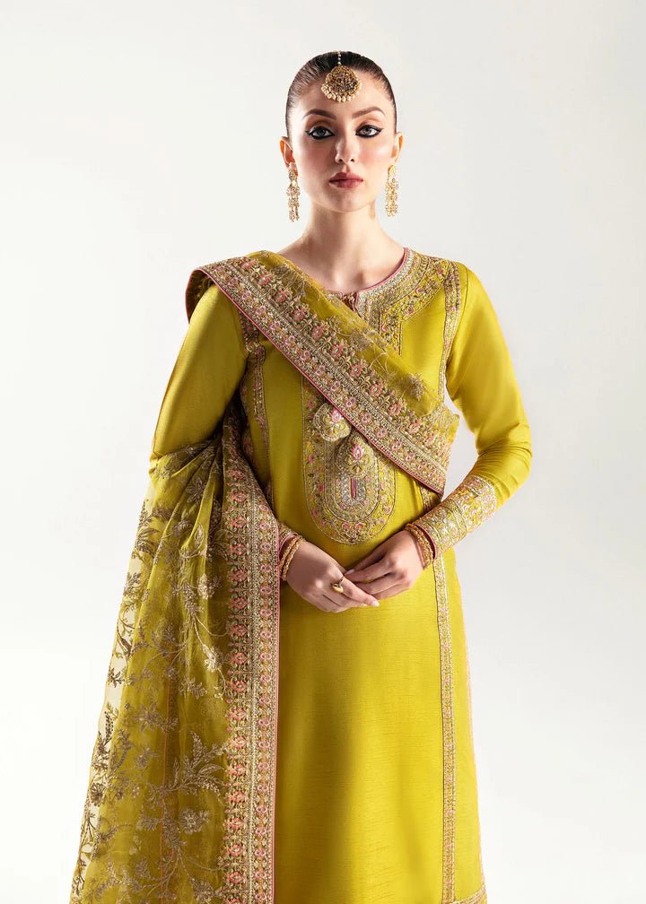 Model wearing a yellow Mahpara dress from Kanwal Malik's Jugan Luxury Pret 2024 collection. Pakistani designer clothes available online in the UK, perfect for weddings.