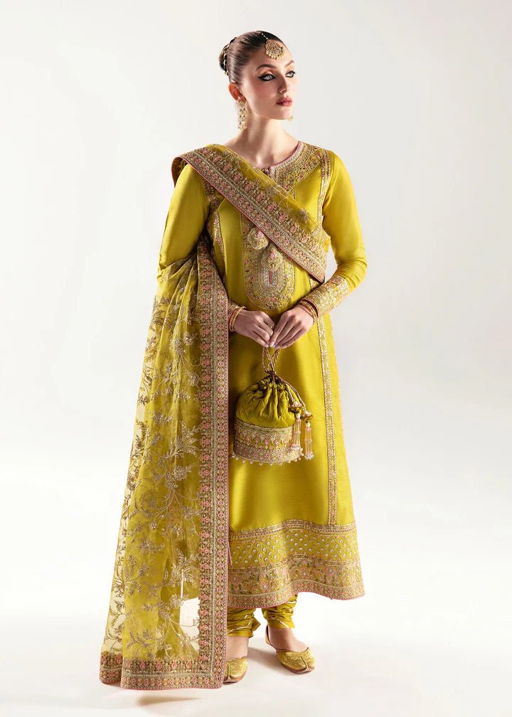 Model wearing a yellow Mahpara dress from Kanwal Malik's Jugan Luxury Pret 2024 collection. Pakistani designer clothes available online in the UK, perfect for weddings.