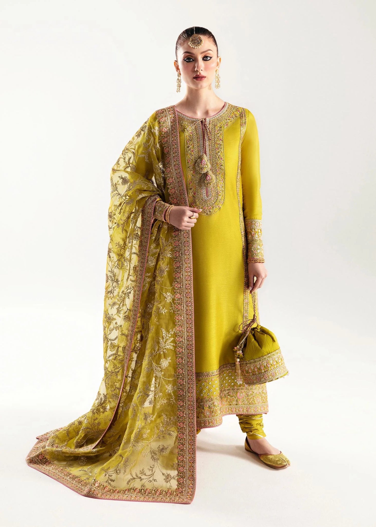 Model wearing a yellow Mahpara dress from Kanwal Malik's Jugan Luxury Pret 2024 collection. Pakistani designer clothes available online in the UK, perfect for weddings.