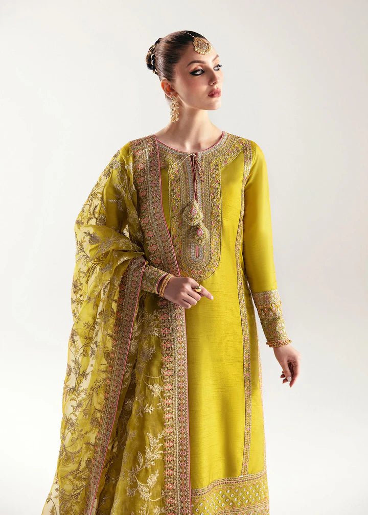 Model wearing a yellow Mahpara dress from Kanwal Malik's Jugan Luxury Pret 2024 collection. Pakistani designer clothes available online in the UK, perfect for weddings.