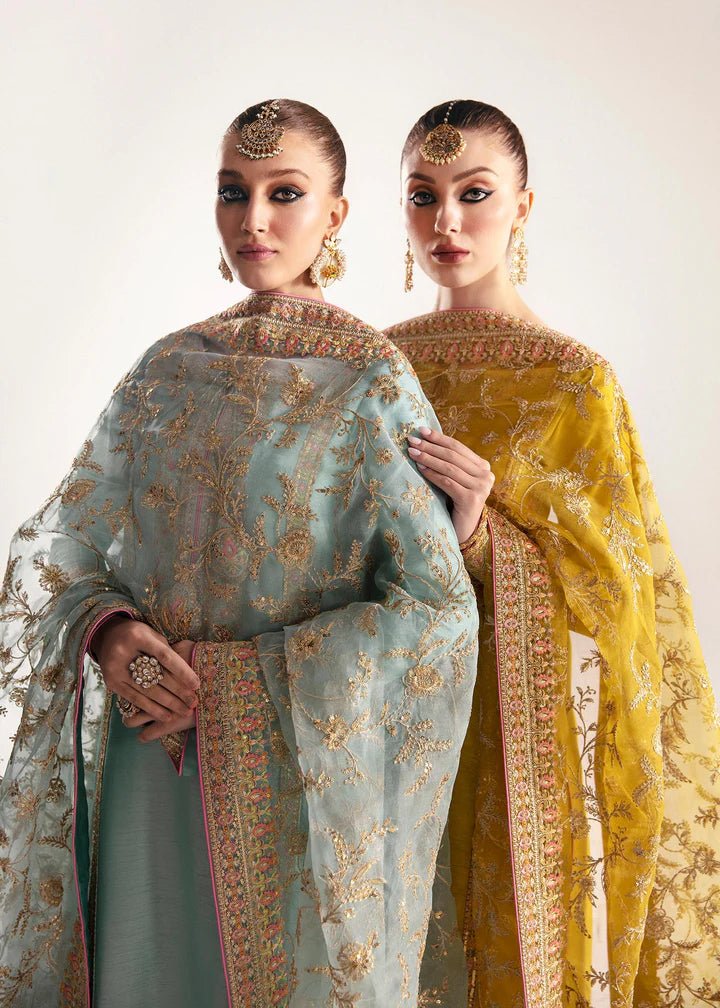 Model wearing a yellow Mahpara dress from Kanwal Malik's Jugan Luxury Pret 2024 collection. Pakistani designer clothes available online in the UK, perfect for weddings.