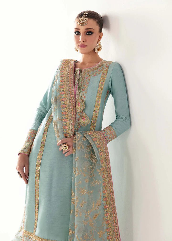 Model wearing light blue Manjeh dress from Kanwal Malik, Jugan Luxury Pret 2024 collection. Pakistani clothes online in UK, wedding clothes.