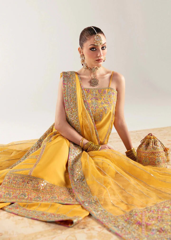 Model wearing yellow Nehal dress from Kanwal Malik, Jugan Luxury Pret 2024 collection. Pakistani clothes online in UK, wedding clothes.