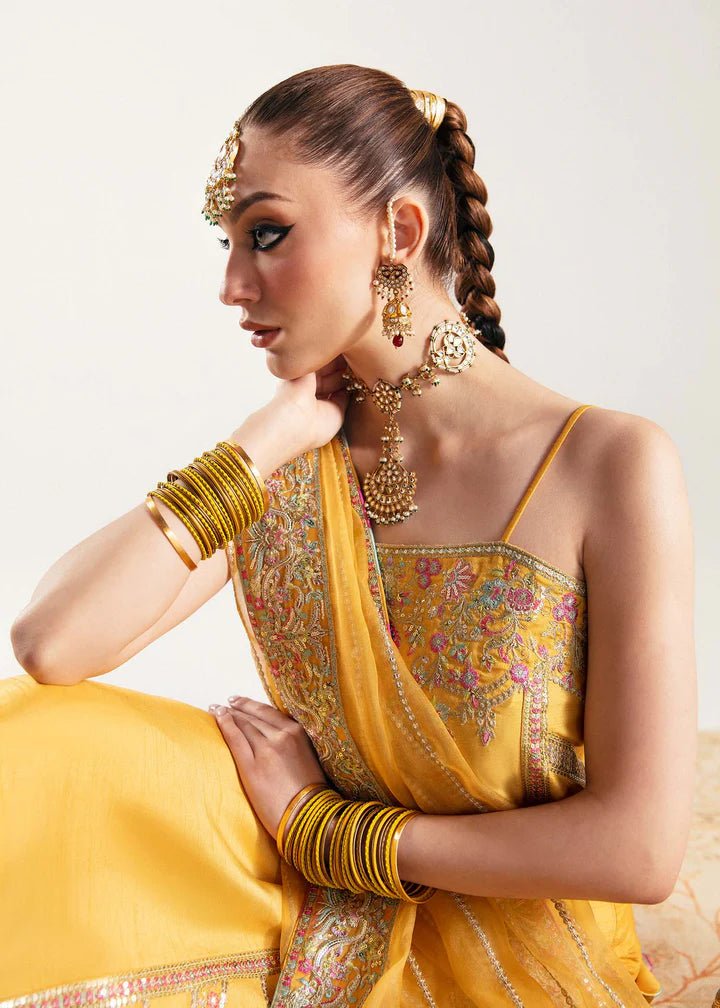 Model wearing yellow Nehal dress from Kanwal Malik, Jugan Luxury Pret 2024 collection. Pakistani clothes online in UK, wedding clothes.