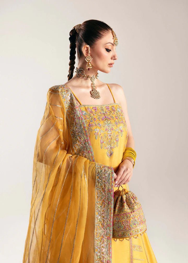 Model wearing yellow Nehal dress from Kanwal Malik, Jugan Luxury Pret 2024 collection. Pakistani clothes online in UK, wedding clothes.