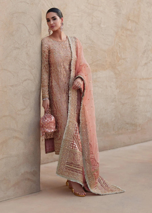 Model wearing Nera from Kanwal Malik's Laira '24 collection, featuring exquisite luxury pret design. Pakistani clothes online in UK.
