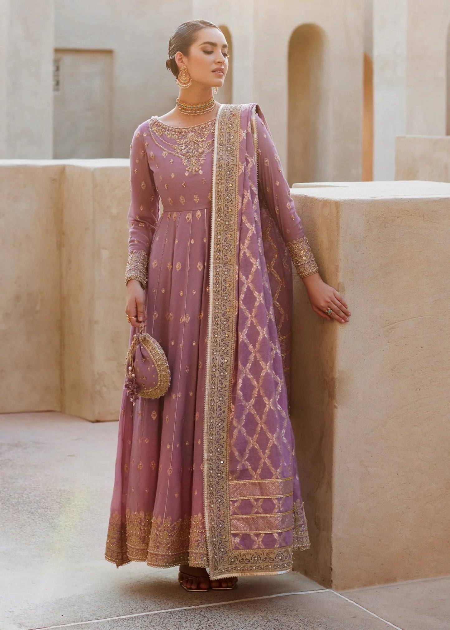 Model wearing Vaneeza from Kanwal Malik's Laira '24, featuring luxurious design. Pakistani clothes online in UK.