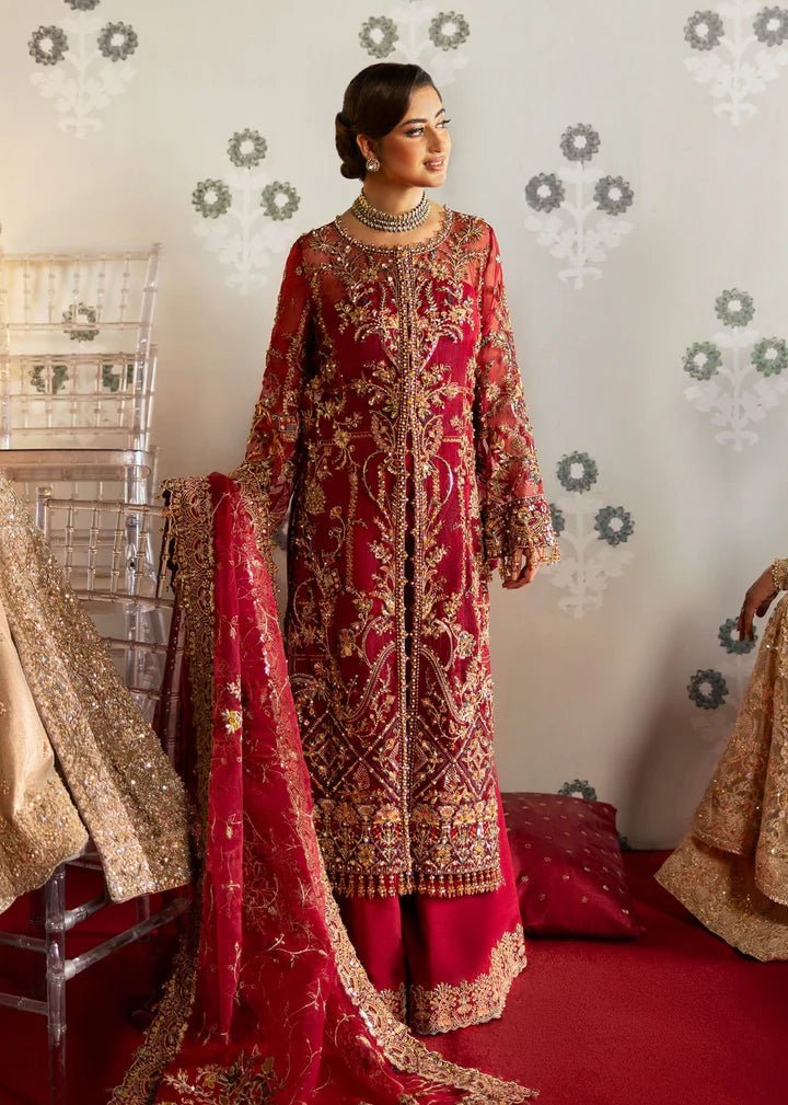 Model wearing Kanwal Malik Maahi Wedding Festive '24 ARMALA, a deep red ensemble with intricate gold embroidery, ideal for wedding celebrations. Available for Pakistani clothes online in the UK.