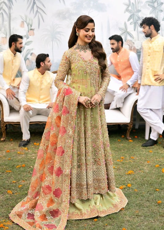 Model wearing Kanwal Malik Maahi Wedding Festive '24 AYAT, a stunning green ensemble with vibrant floral embroidery and an ornate dupatta, perfect for weddings. Available for Pakistani clothes online in the UK.