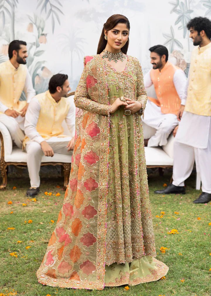 Model wearing Kanwal Malik Maahi Wedding Festive '24 AYAT, a stunning green ensemble with vibrant floral embroidery and an ornate dupatta, perfect for weddings. Available for Pakistani clothes online in the UK.