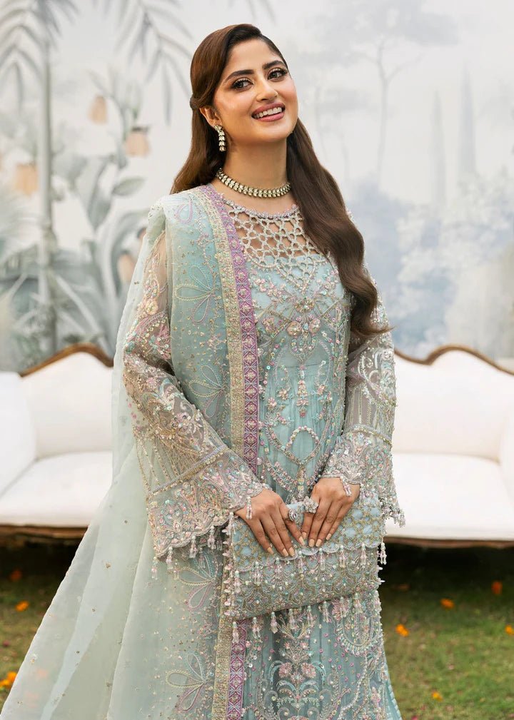 Model wearing Kanwal Malik Maahi Wedding Festive '24 AYZEL, a stunning pastel mint green ensemble with intricate embellishments, perfect for weddings. Available for Pakistani clothes online in the UK.