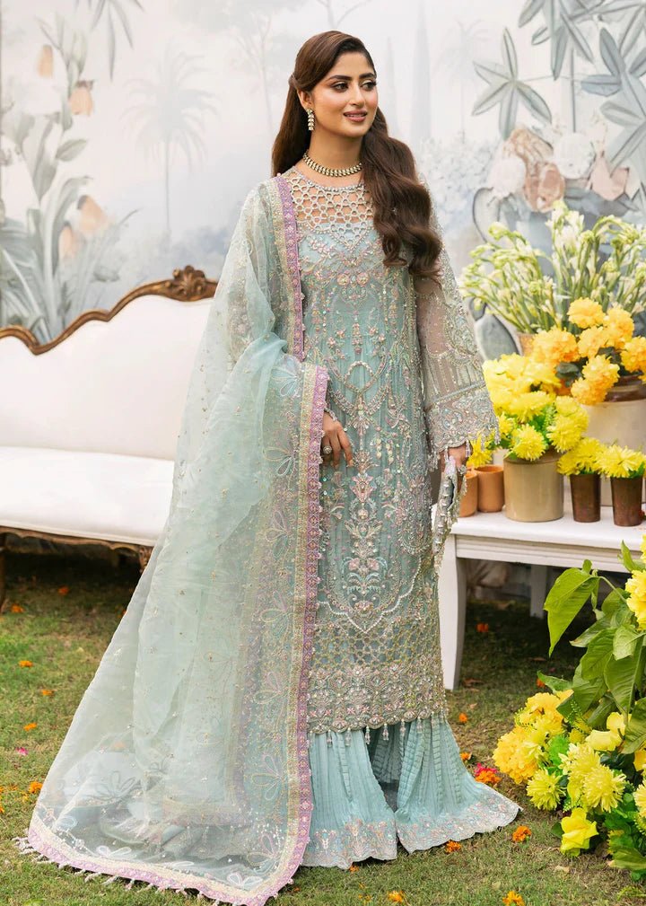 Model wearing Kanwal Malik Maahi Wedding Festive '24 AYZEL, a stunning pastel mint green ensemble with intricate embellishments, perfect for weddings. Available for Pakistani clothes online in the UK.