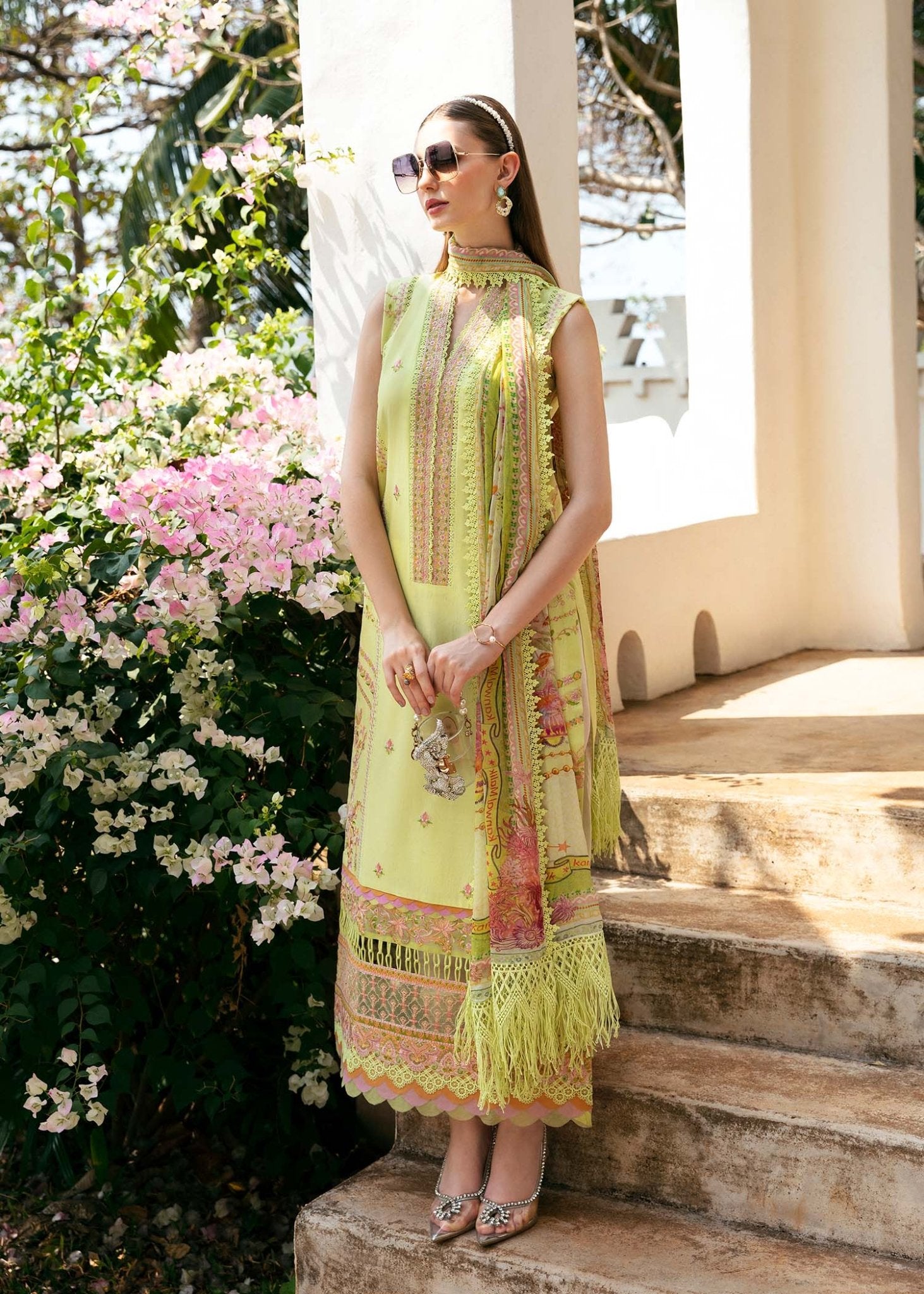 Model wearing Kanwal Malik Anisa dress in lime green with intricate embroidery and fringe, perfect for Pakistani lawn dresses and Eid clothes in the UK.