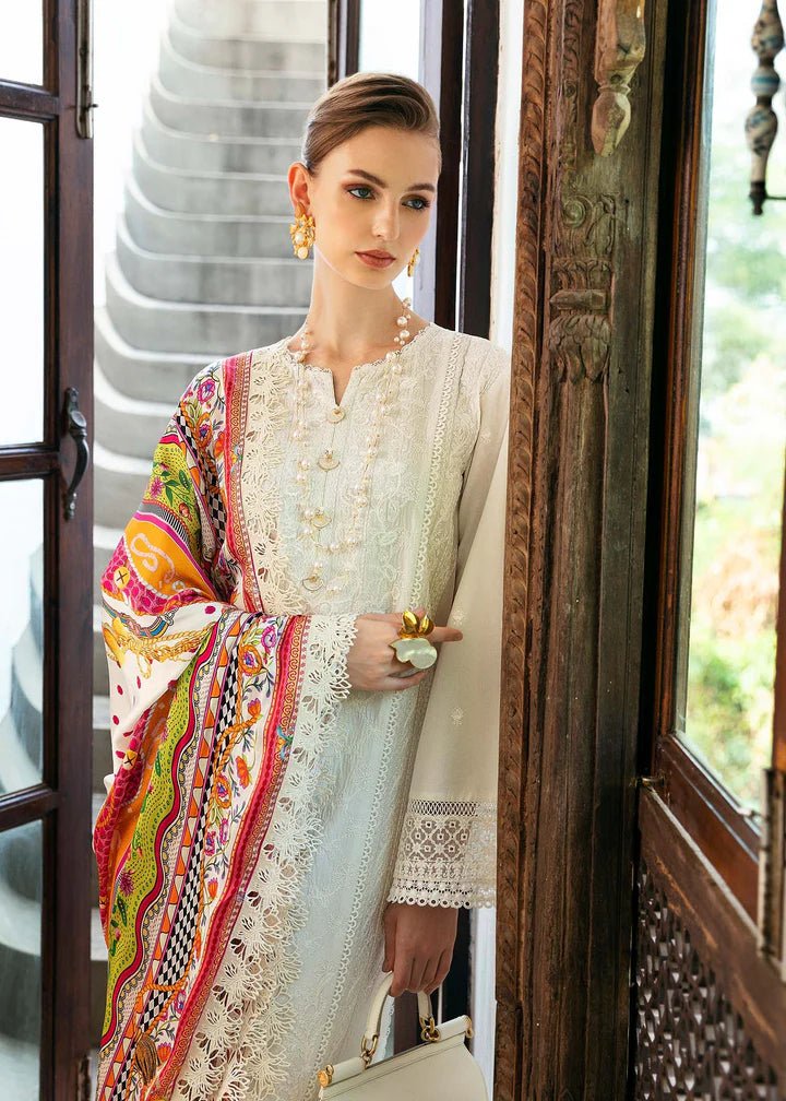 Model wearing a white Cerise dress from Kanwal Malik's Mayal Luxury Lawn collection, featuring vibrant multi - colored accents. Perfect for Pakistani clothes online in the UK.