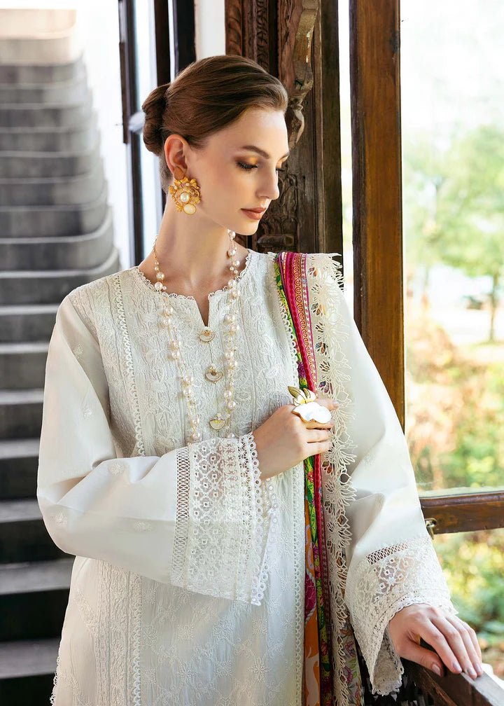 Model wearing a white Cerise dress from Kanwal Malik's Mayal Luxury Lawn collection, featuring vibrant multi - colored accents. Perfect for Pakistani clothes online in the UK.