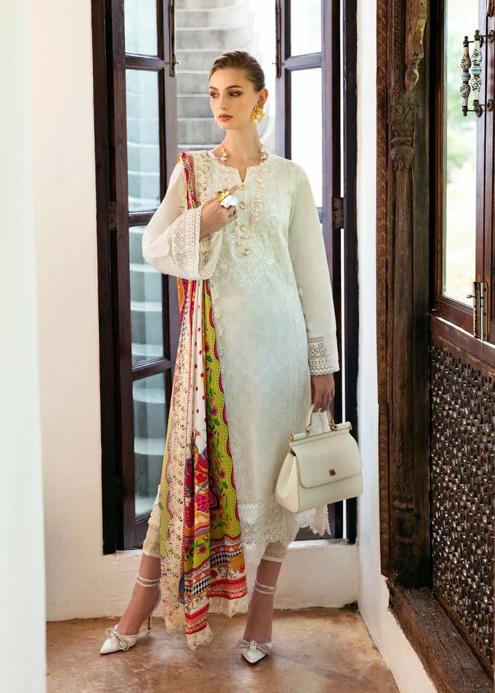 Model wearing a white Cerise dress from Kanwal Malik's Mayal Luxury Lawn collection, featuring vibrant multi - colored accents. Perfect for Pakistani clothes online in the UK.