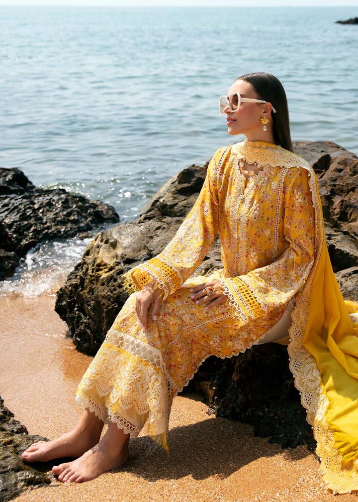 Model wearing a yellow Elara dress from Kanwal Malik's Mayal Luxury Lawn collection, featuring delicate lace detailing and floral patterns. Perfect for Pakistani clothes online in the UK.