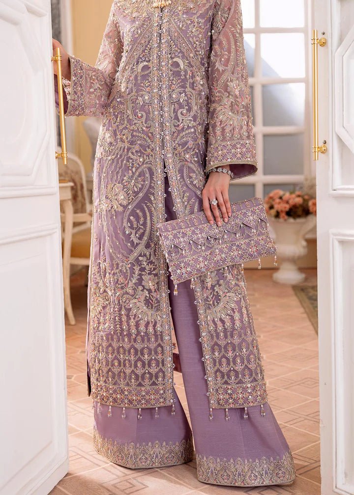 Model wearing a lilac NAIRA dress from Kanwal Malik's MIRHA II '23 collection. Pakistani designer clothes available online in the UK, perfect for weddings.