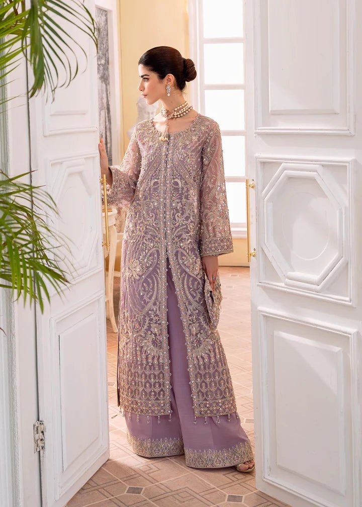 Model wearing a lilac NAIRA dress from Kanwal Malik's MIRHA II '23 collection. Pakistani designer clothes available online in the UK, perfect for weddings.