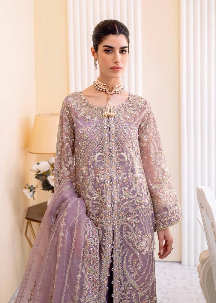 Model wearing a lilac NAIRA dress from Kanwal Malik's MIRHA II '23 collection. Pakistani designer clothes available online in the UK, perfect for weddings.