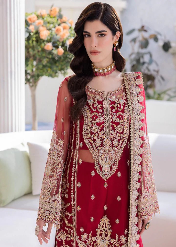 Model in Kanwal Malik MIRHA III Eid 24 Crimson dress, red suit with golden embriodery enhancing Pakistani clothes online in the UK.