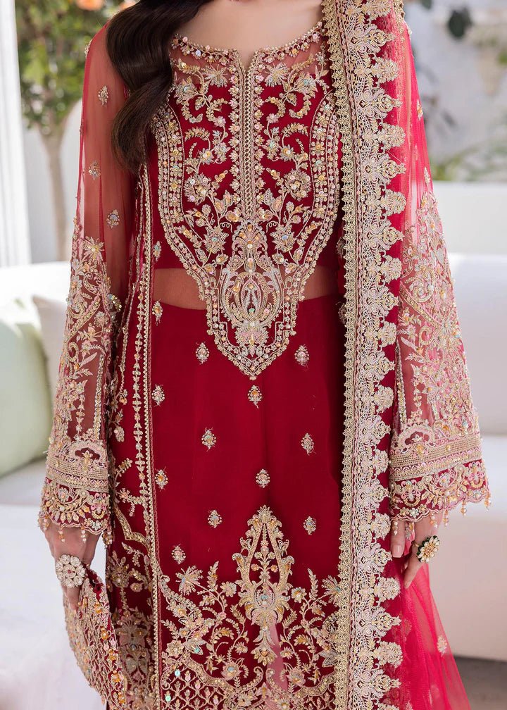 Model in Kanwal Malik MIRHA III Eid 24 Crimson dress, red suit with golden embriodery enhancing Pakistani clothes online in the UK.