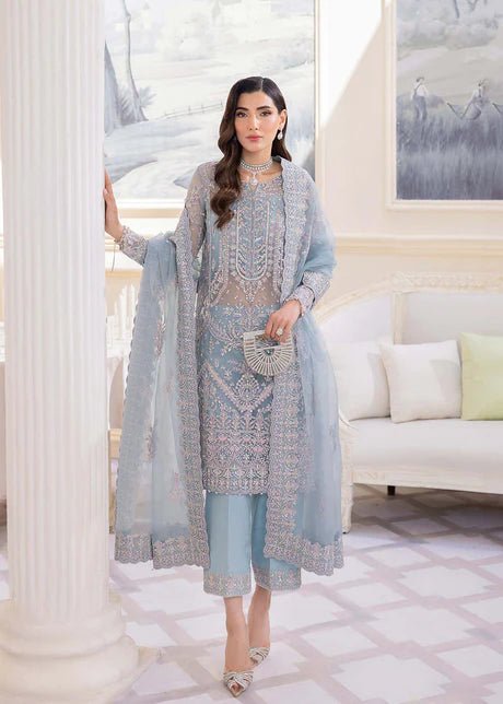 Model wearing Kanwal Malik Elsa dress, powder blue with heavy embellishment, Pakistani clothes UK.