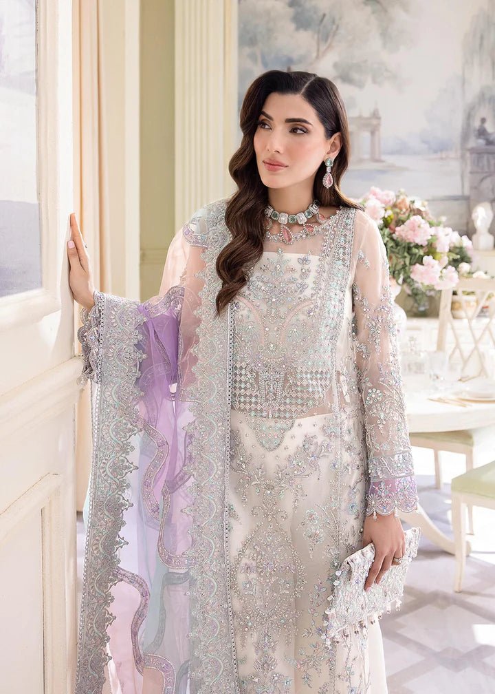 Model wearing Kanwal Malik MIRHA III Eid 24 Lumina dress in white, showcasing Pakistani wedding clothes online in the UK.