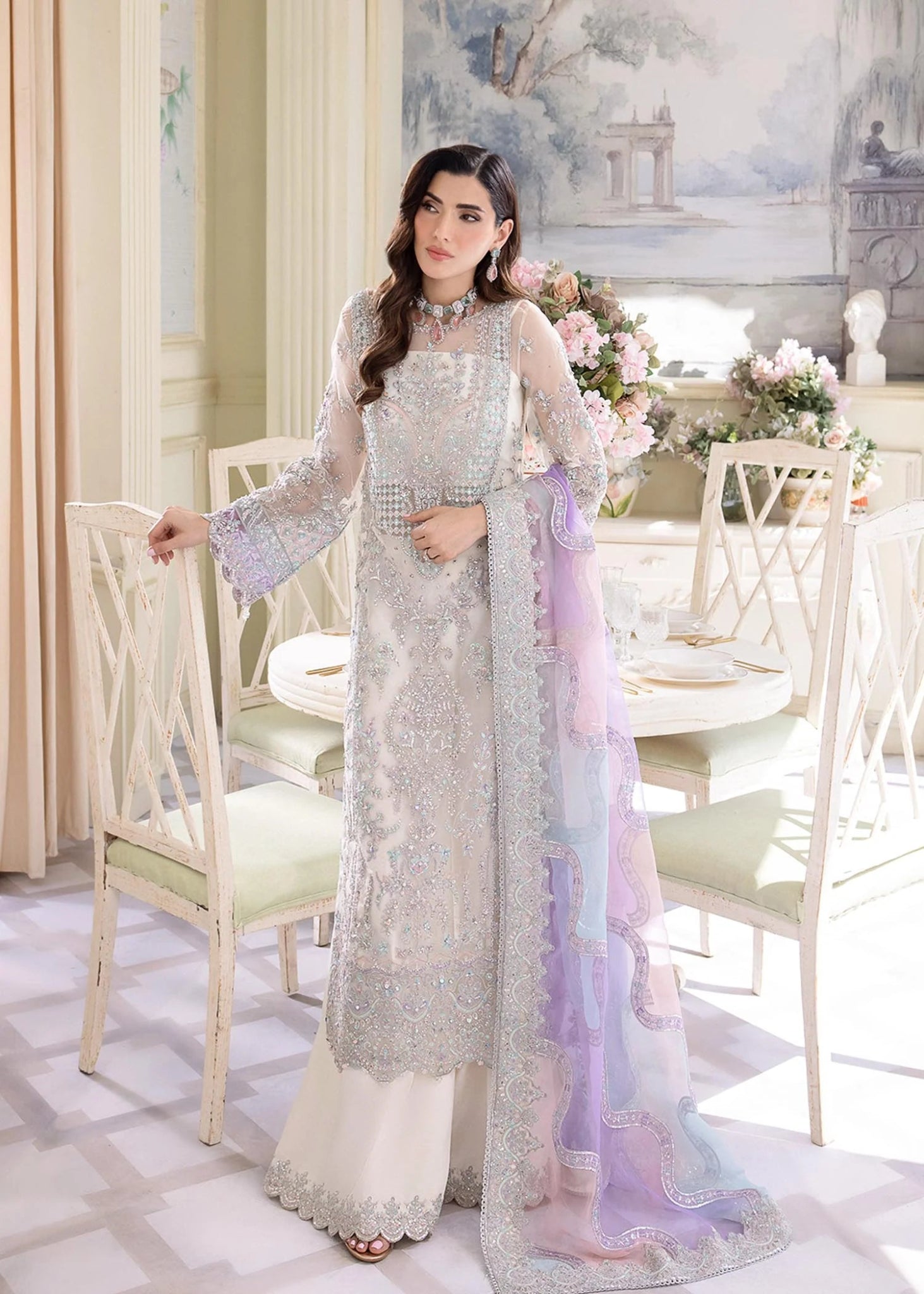 Model wearing Kanwal Malik MIRHA III Eid 24 Lumina dress in white, showcasing Pakistani wedding clothes online in the UK.