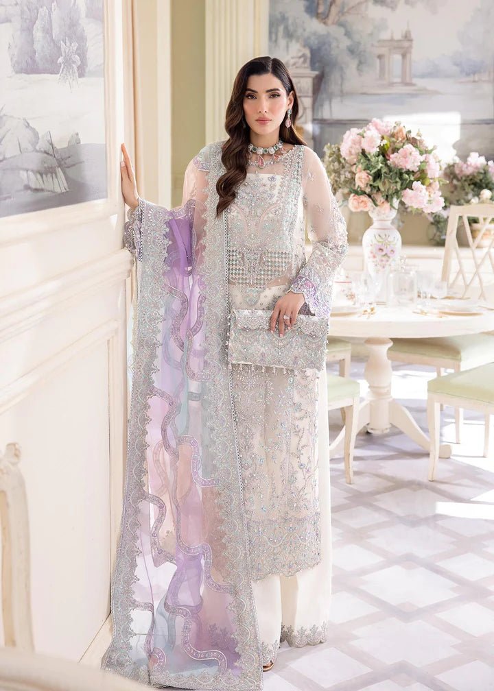 Model wearing Kanwal Malik Lumina dress, delicate pearl embellished with lilac hues, Pakistani UK attire.