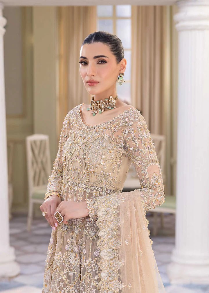 Model showcasing Kanwal Malik MIRHA III Eid 24 Nia dress, a nude pishwas elevating Pakistani clothes online in the UK.