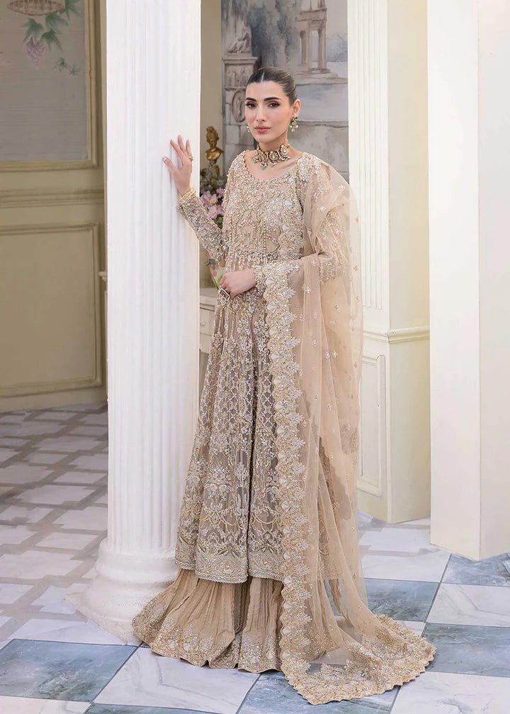 Model showcasing Kanwal Malik MIRHA III Eid 24 Nia dress, a nude pishwas elevating Pakistani clothes online in the UK.