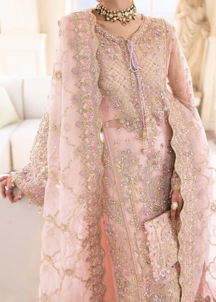 Model wearing Kanwal Malik MIRHA III Eid 24 Orchid dress in pastel pink, enhancing Pakistani wedding clothes online in the UK.