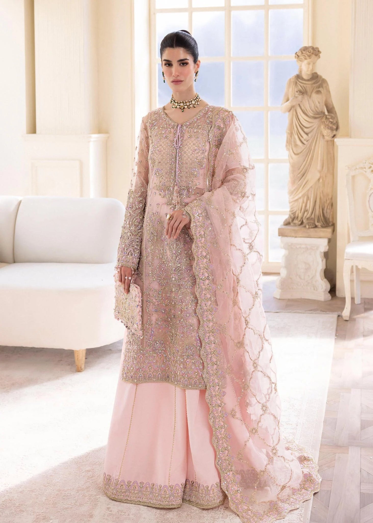 Model wearing Kanwal Malik MIRHA III Eid 24 Orchid dress in pastel pink, enhancing Pakistani wedding clothes online in the UK.