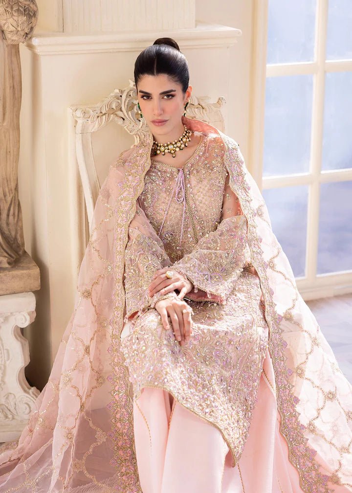 Model wearing Kanwal Malik MIRHA III Eid 24 Orchid dress in pastel pink, enhancing Pakistani wedding clothes online in the UK.