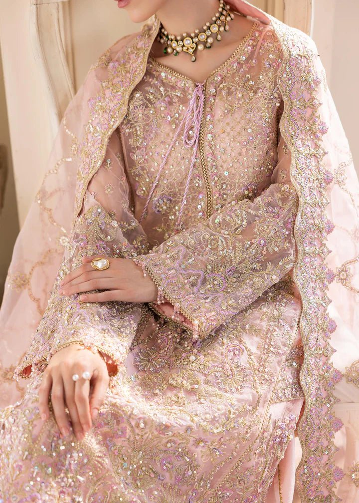 Model wearing Kanwal Malik MIRHA III Eid 24 Orchid dress in pastel pink, enhancing Pakistani wedding clothes online in the UK.