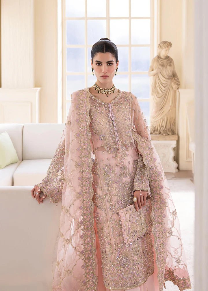 Model wearing Kanwal Malik MIRHA III Eid 24 Orchid dress in pastel pink, enhancing Pakistani wedding clothes online in the UK.