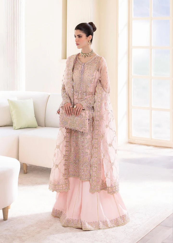 Model wearing Kanwal Malik MIRHA III Eid 24 Orchid dress in pastel pink, enhancing Pakistani wedding clothes online in the UK.