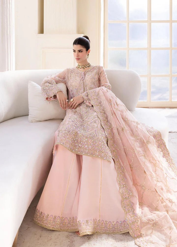 Model wearing Kanwal Malik MIRHA III Eid 24 Orchid dress in pastel pink, enhancing Pakistani wedding clothes online in the UK.