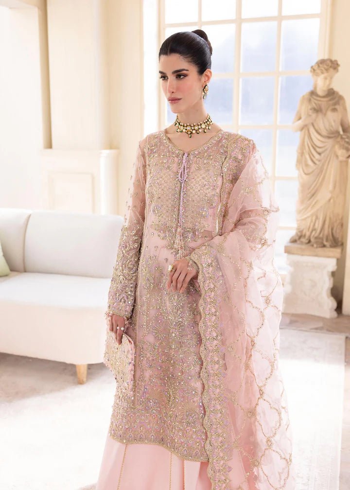 Model wearing Kanwal Malik MIRHA III Eid 24 Orchid dress in pastel pink, enhancing Pakistani wedding clothes online in the UK.