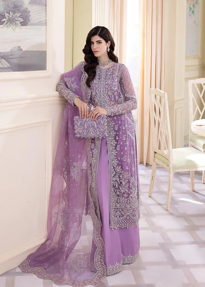 Model wearing Kanwal Malik Talia dress, lilac with intricate silver embroidery, Pakistani UK fashion.