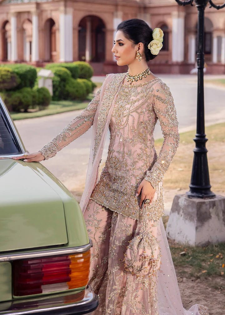 Model wearing Kanwal Malik Raaniyan Luxury Formals Aria dress in blush pink, Pakistani bridal clothes online in UK.