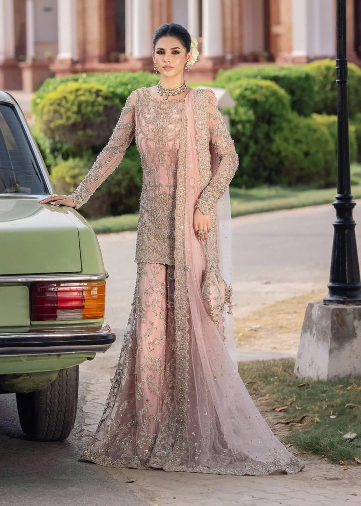 Model wearing Kanwal Malik Raaniyan Luxury Formals Aria dress in blush pink, Pakistani bridal clothes online in UK.