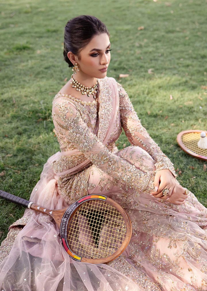 Model wearing Kanwal Malik Raaniyan Luxury Formals Aria dress in blush pink, Pakistani bridal clothes online in UK.