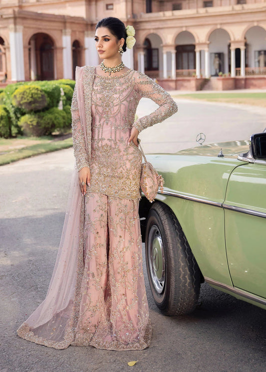 Model wearing Kanwal Malik Raaniyan Luxury Formals Aria dress in blush pink, Pakistani bridal clothes online in UK.