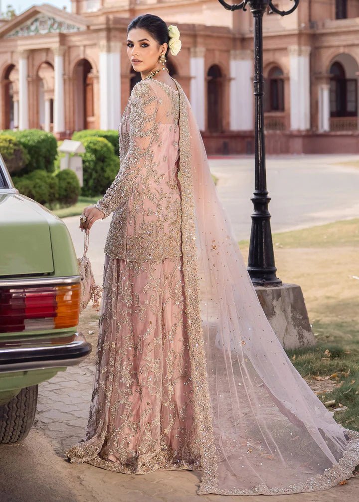 Model wearing Kanwal Malik Raaniyan Luxury Formals Aria dress in blush pink, Pakistani bridal clothes online in UK.