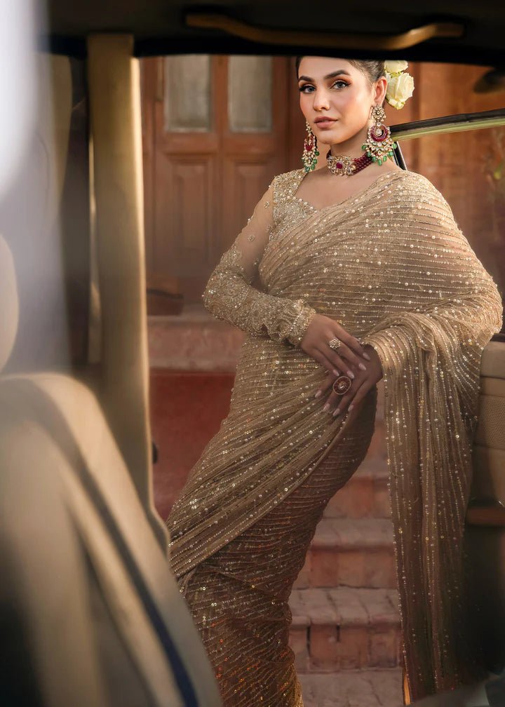 Model wearing Kanwal Malik Raaniyan Luxury Formals Mehrunisa dress in gold, Pakistani bridal clothes online in UK.