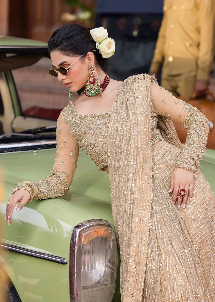 Model wearing Kanwal Malik Raaniyan Luxury Formals Mehrunisa dress in gold, Pakistani bridal clothes online in UK.